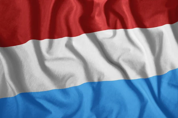 Acenando bandeira do Luxemburgo em fundo de seda — Fotografia de Stock