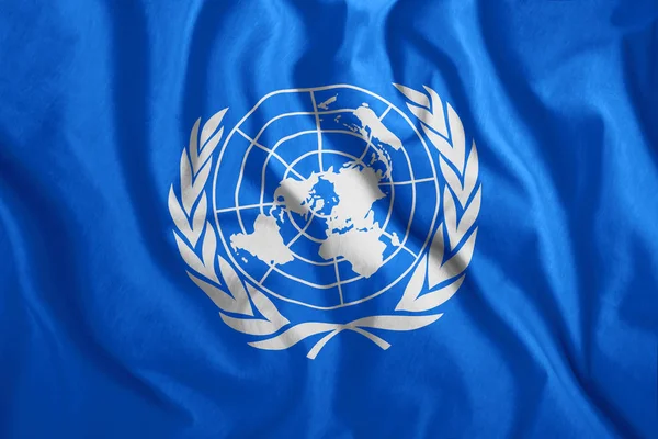 BM bayrağı havada uçuyor. Renkli BM bayrağı. Sembol, birleşme.