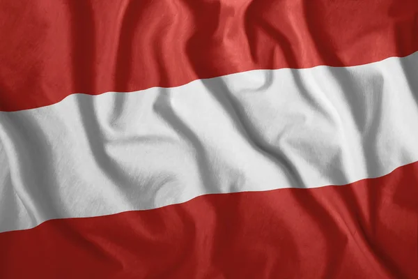 La bandera austríaca ondea en el viento. Colorida bandera nacional de Avsiria. Patriotismo, símbolo patriótico . — Foto de Stock