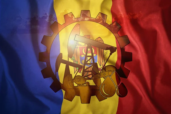 Oljerigg på bakgrunden av flaggan för Moldavien. Blandad miljö. Begreppet oljeproduktionen, mineraler, utveckling av nya fyndigheter, väl. — Stockfoto