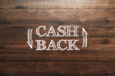 Yazıt Cash Back, ahşap arka plan üzerinde amblem görüntüsünü. Simge, bu kadar para sembolü. İş, finans kavramı.
