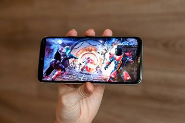 Brest, Belarus, January 31, 2020: Mobile game Shadow Gun Legends on the Xiaomi Redmi Note 8 smartphone screen close-up. A person is playing a game on a smartphone. clipart