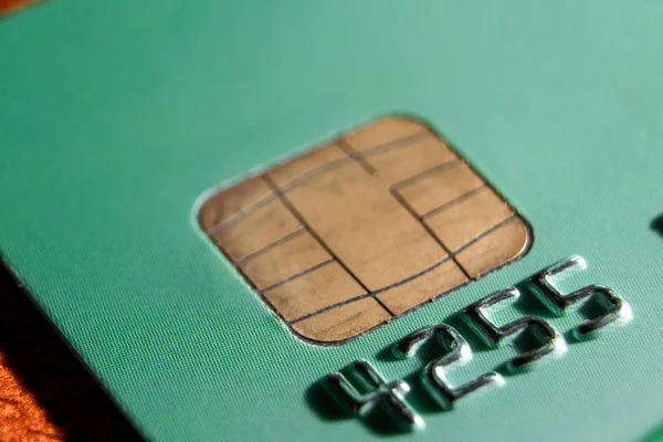 Micro credit card chip close-up, soft focus. New technologies, EMV chip card, smart payment cards.