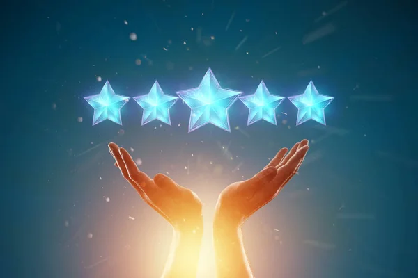 Close-up of a hand and 5 stars, assignment of a new rating, evaluation of services, a new level, business concept. mixed medium. — Stock Photo, Image