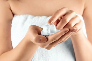 Female beautiful well-groomed hands with shaving foam close-up. Body care, personal hygiene, female beauty.