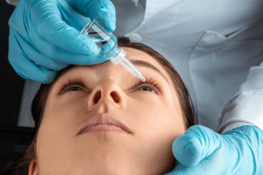 An ophthalmologist injects drops into the eyes of patients in an ophthalmic clinic. Health, vision, eye disease.
