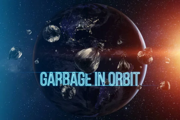 The inscription garbage in orbit. garbage in low Earth orbit, dangerous trash around the planet. Elements of this image furnished by NASA. — Stock Photo, Image