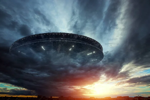 UFO, an alien plate soars in the sky, hovering motionless in the air. Unidentified flying object, alien invasion, extraterrestrial life, space travel, humanoid spaceship mixed medium Royalty Free Stock Photos