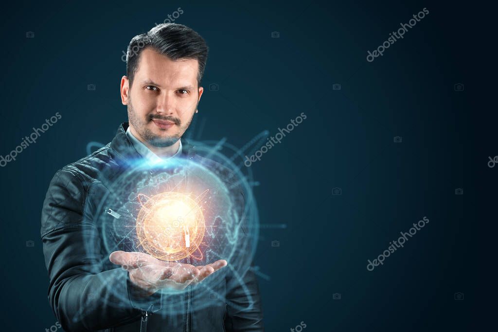 Businessman man holds a hologram of planet earth on his hand. Globalization, network, fast Internet, new technologies in communication. Copy space Mixed media