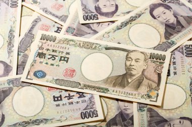 Japanese bank note 10000 yen on 5000 yen clipart