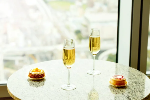 Closeup of delicious cake and glass of champagne