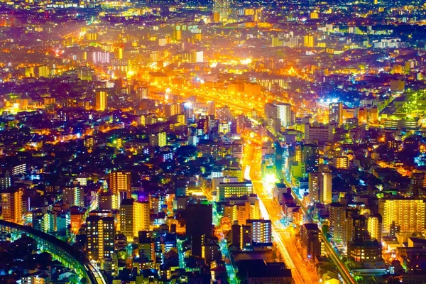 Vista de paisagem urbana de luz noturna com edifício moderno no japão — Fotografia de Stock