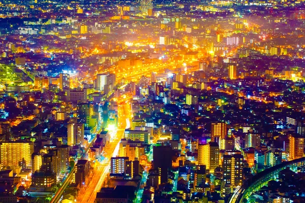 Vista de paisagem urbana de luz noturna com edifício moderno no japão — Fotografia de Stock