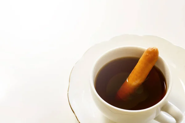 A cup of tasty coffee with a sausage, isolated on white. It's called Vienna coffee in japanese. — Stock Photo, Image