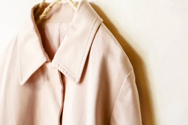 Pink elegant trench coat isolated over white — Stock Photo, Image