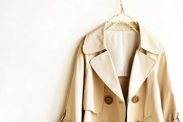 Beige elegant trench coat isolated over white — Stock Photo, Image