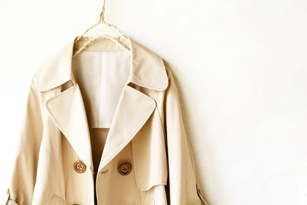 Beige elegant trench coat isolated over white — Stock Photo, Image