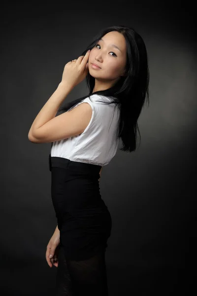 Asian girl in T-shirt and shorts — Stock Photo, Image