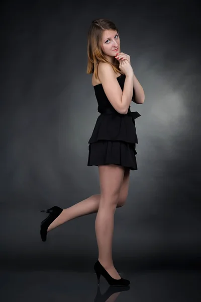 Girl in black dress — Stock Photo, Image