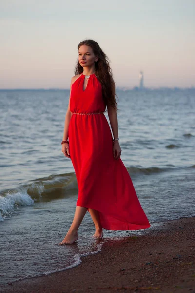 Beautiful woman in red dress — Stock Photo, Image