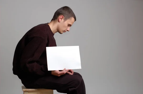 Young man with blank board — Stock Photo, Image
