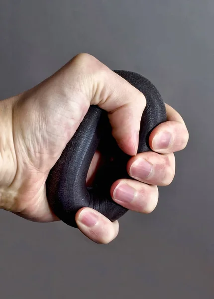 Rubber expander in hand — Stock Photo, Image