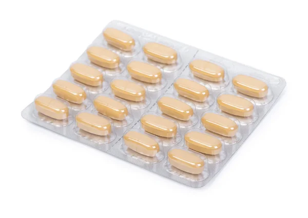 Sárga Tabletták Fehér Alapon Izolált Buborékcsomagolásban — Stock Fotó