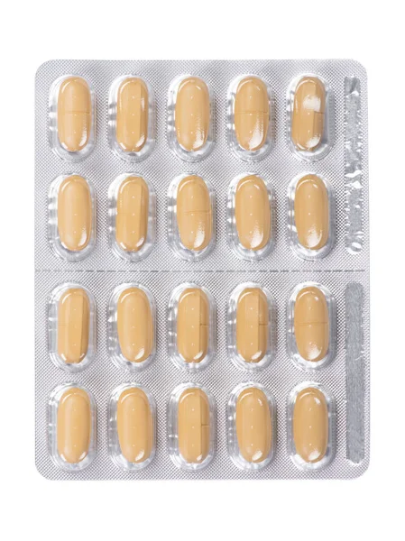 Pílulas Amarelas Uma Embalagem Blister Isolada Fundo Branco — Fotografia de Stock