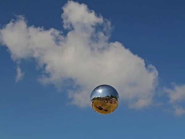 a floating silver sphere