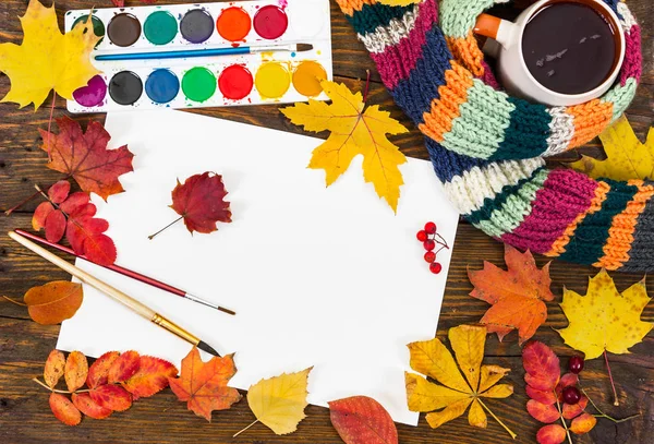 Workplace of artist. Sheet of paper, paints, brushes and autumn — Stock Photo, Image