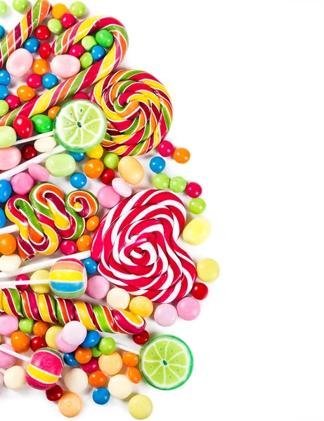 Színes cukorkák, nyalókák és — Stock Fotó