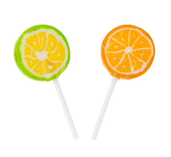 Two lollipop flavored with lime and orange — Stock Photo, Image