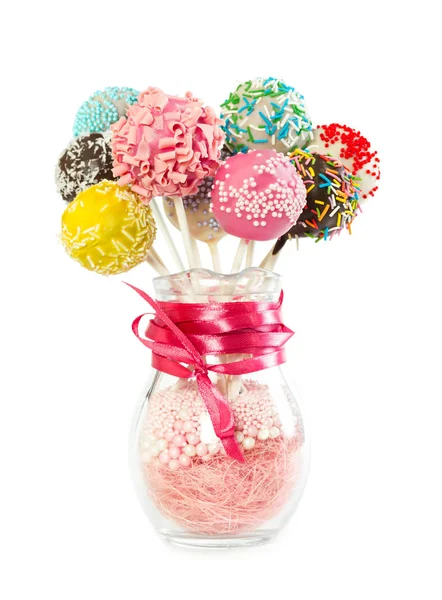 Pastel colorido aparece con aspersiones decorativas en jarrón de vidrio —  Fotos de Stock