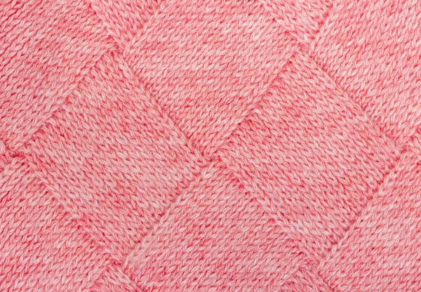 Textur aus Strickstoff aus rosa Wollfäden. — Stockfoto