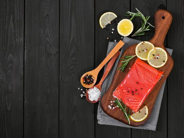 Fillet of salmon on cutting board