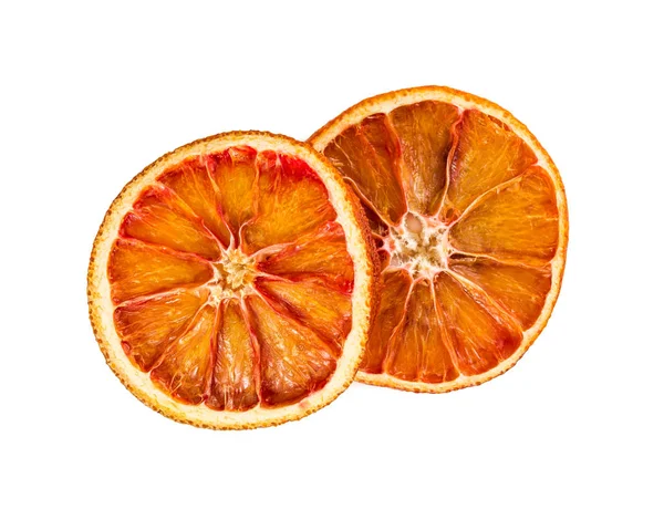 Twee gedroogde stukjes sinaasappel geïsoleerd op witte achtergrond. — Stockfoto