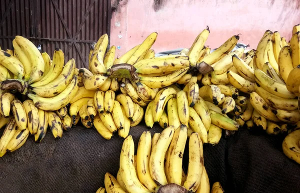 Bunch Of Fresh Bananas At A Street Market In India.These bananas are mature and ready to be eaten. Banana is a food rich of energy.