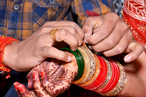 Indian couple playing Ring Fishing game in wedding ceremony of India