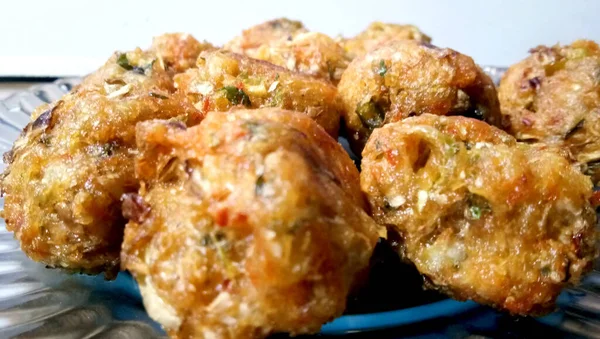 Veg Manchurian dry - Popular food of India made of cauliflower florets and other vegetable, selective focus