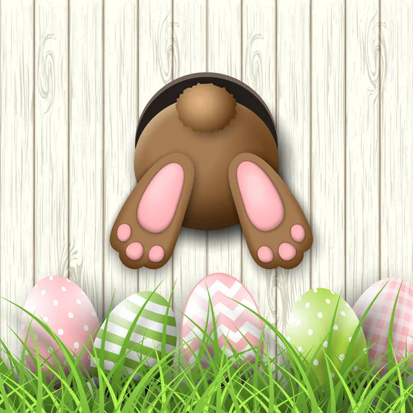 Motivo de Pascua, fondo de conejo y huevos de pascua en hierba fresca sobre fondo de madera blanca, ilustración — Vector de stock