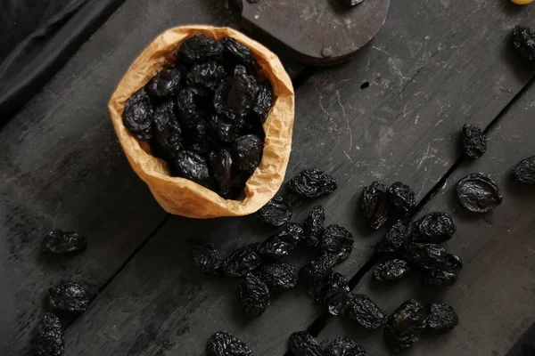 Prunes on a dark background — Stock Photo, Image
