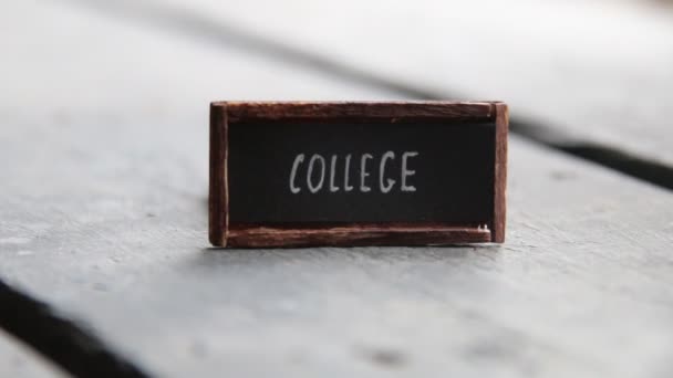 College, tag on vintage table — Stock Video