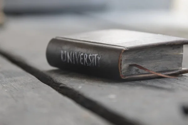University - inscription on the book — Stock Photo, Image