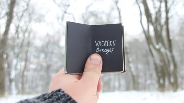 Vakantie pakketten concept. Vintage boek met inscriptie — Stockvideo