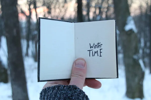 Winter time idea. Book with the inscription.