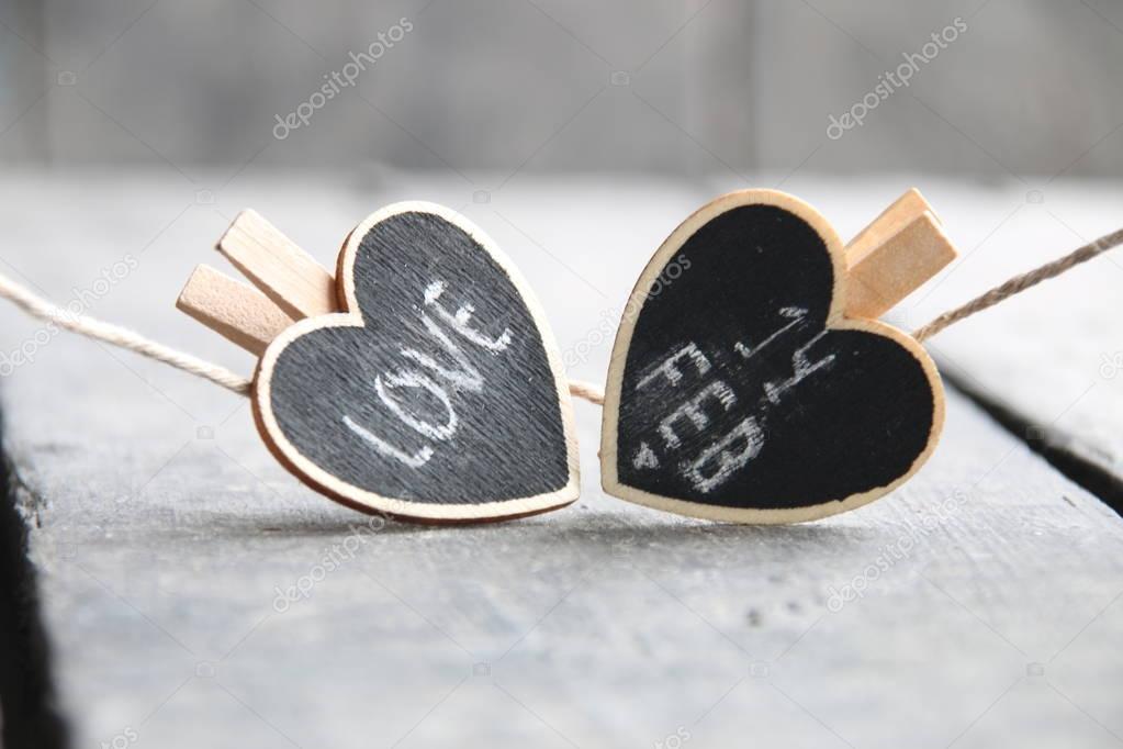 St Valentines day idea. 14th of February and love inscriptions on the two hearts.