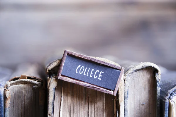 College tag and old retro books — Stock Photo, Image