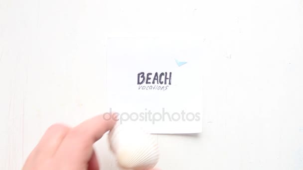 Art Beach vacation concept, text and seashell — стоковое видео