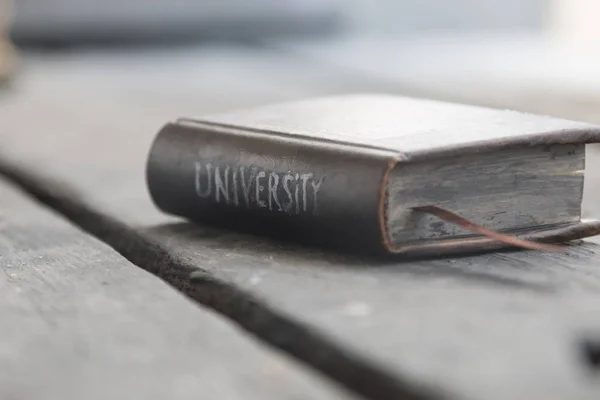 University - the inscription on the book — Stock Photo, Image