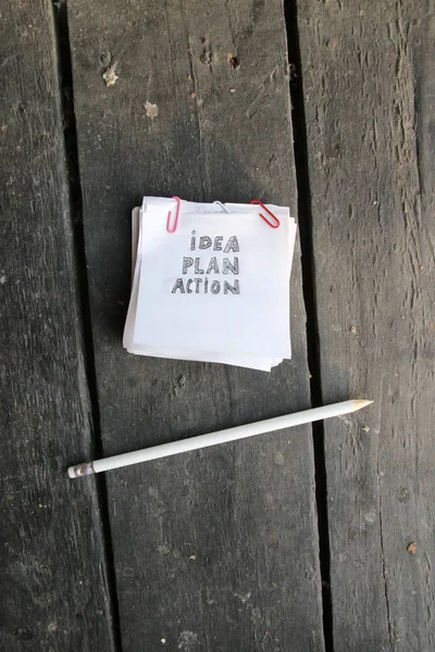 Idea piano d'azione concetto, iscrizione su un foglio bianco di carta — Foto Stock